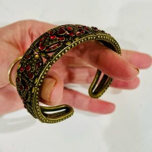 Vintage 1980s Red Rhinestone Antiqued Gold Flexible Panel Cuff Bracelet